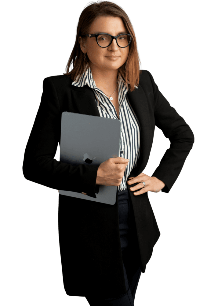 Katrina Kabacinska-Pietrzak, founder of AccountWell & Co., holding a laptop
